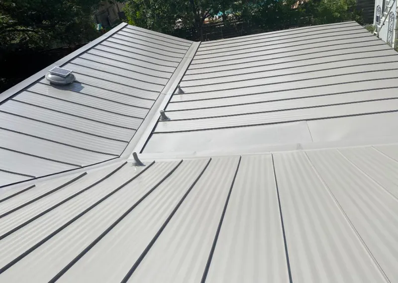 Solar attic fan installed on a metal roof for Roof Ventilation in Everett